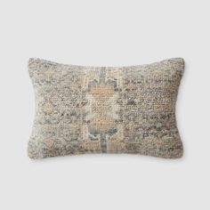 a pillow with an old, faded design on the front and back of it's cushion