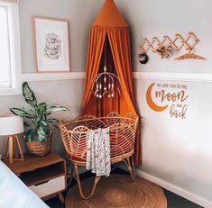 a room with an orange drapes and wicker furniture