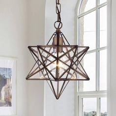 a light fixture hanging from the ceiling in a room