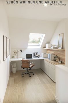 an office area with a desk, chair and shelves in the corner under a slanted skylight