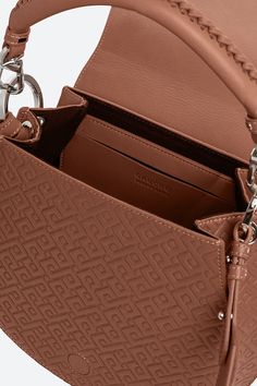 Meet the Lucky bag: yes, it leads a charmed life and yes, we’re here for it, because this design has ALL the hallmarks of ‘us’: incredible craftsmanship, gaucho influences and a contemporary urban vibe. We’ve brought these elements together in the classic saddle shape; the sturdy yet super-soft calfskin leather; and the equestrian-style braided grab handle. Then there’s the graphic contrasting stitching: a satisfying twist that gives those 70s vibes a bolder, more architectural feel. We’ve made Contrasting Stitching, 70s Vibes, Leather Saddle Bags, Feeling Good, Equestrian Style, Saddle Bag, Braid Styles, Leather Accessories, Embossed Leather