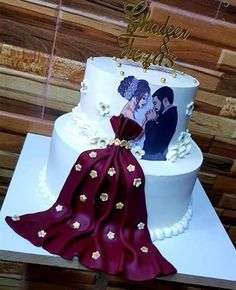 two tiered wedding cake with photo on top