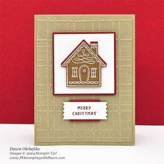 a handmade christmas card with a gingerbread house on the front and red background