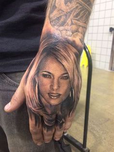 a person with a tattoo on their hand