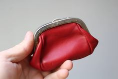 Small red leather purse.Vintage purse.Coin purse.Snap Close Coin Purse.Leather Women's Coin Pocket Wallet.Coin Purse.Coin Holder. A luxury change purse for an 80s lady. This vintage coin purse is beautifully crafted from butter soft leather. In good vintage condition and light wear expected from years of service. Dimensions: Width: about 11.5 cm (4.52 inch) Height: about 7.5 cm (2.95 inch) Depth: about 2 cm (0.78 inch) In my shop I have more vintage items https://www.etsy.com/shop/DecorVintageSh Red Leather Purse, Purse Vintage, Coin Holder, Pocket Wallet, Vintage Purse, Change Purse, Purse Pouch, Leather Purse, Red Leather