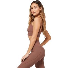 Who says sporty can't be sassy? With the Soren Top, you can be both. Featuring a cinched front detail with an under bust band, this top is crafted from rib fabric and comes with adjustable straps. Fitted Athleisure Activewear With Ruched Sides, Athleisure Activewear With Ruched Sides And Stretch, Stretch Athleisure Activewear With Ruched Sides, Fitted Ribbed Sports Bra, Sporty Stretch Ruched Tops, Solid Ruched Activewear For Yoga, Spring Fitted Ruched Activewear, Sporty Fitted Tops With Ribbed Waistband, Fitted Ruched Activewear For Gym