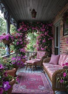 a porch covered in lots of pink flowers