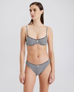 A fan favorite suit, The Daphne Bikini Bottom is perfectly 90s inspired. This ric rak detailed bottom with an adorned daisy at the center is a low-rise suit with cheeky coverage. Updated in a soft gingham fabrication, this suit is the perfect addition this season. Pair it with the coordinating Daphne Bikini Top to complete the look. Denim Joggers, Long Sleeve Flannel, Casual Hat, Solid & Striped, 90s Inspired, Paige Denim, Women Clothing Boutique, New Tops, Casual Denim