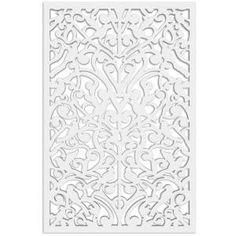 a white laser cutout with an intricate design on the front and back of it