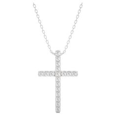 Carat Weight: This exquisite cross pendant boasts a total carat weight of 0.09 carats, offering a subtle yet captivating sparkle. Diamonds: Adorning the cross pendant are 18 meticulously chosen diamonds, selected for their brilliance and quality. These diamonds are thoughtfully arranged, adding a touch of radiance to the sacred symbol. Gold Purity: Crafted with precision in luxurious 14k white gold, the pendant weighs 1.68 grams, ensuring both durability and opulence. The white gold setting complements the diamonds, enhancing their natural brilliance. Pendant Dimensions: With a graceful length of 13.8 mm and a width of 1.5 mm, this cross pendant strikes a perfect balance between elegance and presence, making it a versatile and timeless piece. This cross pendant is a testament to the seamle White Gold Set, Sacred Symbols, Sparkle Diamonds, The Cross, Cross Pendant, Timeless Pieces, The White, Jewelry Necklace Pendant, Jewelry Necklaces