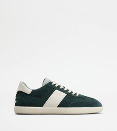 Tabs sneakers in calfskin suede with smooth leather inserts, logo stamped on the side and rubber outsole. An iconic style of Tod's world, with sober and refined lines. Modern Green High-top Sneakers With Rubber Sole, Luxury Green Sneakers With Branded Insole, Luxury Green Low-top Sneakers, Modern Green Sneakers With Rubber Sole, Classic Green Sneakers With Perforated Toe Box, Green Sneakers With Leather Sole And Round Toe, Green High-top Sneakers With Rubber Heel Cap, Green Sporty High-top Sneakers With Rubber Heel Cap, Sporty Green High-top Sneakers With Rubber Heel Cap