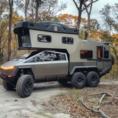 an off - road vehicle is parked in the woods