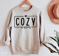 Cute Winter Shirts Vinyl, Cozy Season Outfits, Winter Vinyl Shirts, Fall Sweater Cricut, Fall Cricut Shirts Svg, Sublimation Sweater Ideas, Sweater Vinyl Ideas, Cute Fall Shirt Designs, Cozy Season Sweatshirt