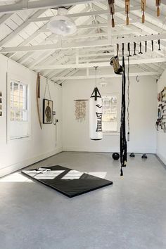 an empty room with various objects hanging from the ceiling