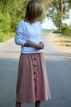 Trapezoidal button skirt made of 100% cotton. It has 2 comfortable pockets in the side seams. It looks good on most silhouettes and works great on different occasions. Size (total length / waist) US ---- UK --- EU/DE 4 ------ 6 ----- 34/XS (78/72) 6 ------ 8 ----- 36/S (78/76) 8 ----- 10 ---- 38/M (79/80) 10 ---- 12 ---- 40/L (80/84) 12 ----- 14 --- 42/XL (81/88) Dimensions in cm. 100% cotton Are you interested in a different color or size write to us Production method:sewn - own machinery - pro Long Cotton Skirt With Buttons, Relaxed Cotton Skirt With Buttons, Relaxed Cotton Maxi Skirt With Buttons, Casual Pink Cotton Maxi Skirt, Pink Cotton Maxi Skirt, Casual Pink Skirt With Buttons, Autumn Skirt, Handmade Skirts, Skirt With Buttons