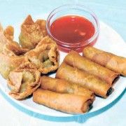 some fried food is on a plate with dipping sauce