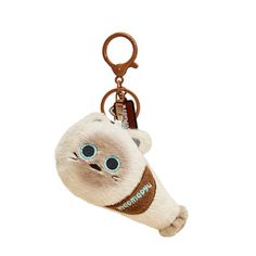 a keychain with a stuffed animal hanging from it's front end and eyes