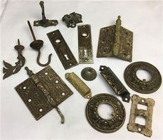 an assortment of antique door handles and knobs