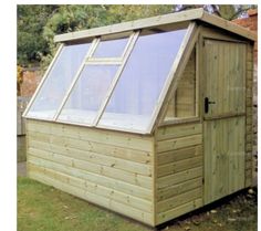 a small wooden shed with windows on the side