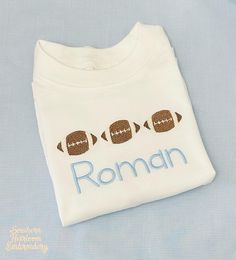 Get your little one ready for football games with this adorable shirt! These shirts have high quality construct, 100% combed cotton interlock cotton, naturally tapered shoulder and ribbed neck. White Shirt For Football Game Day, White Shirt For Game Day Football Season, Cotton Tops With Name Print For Football Season, Varsity T-shirt With Name Print For Football Season, Collegiate Custom Print T-shirt For Football Season, Football Season Custom Print Crew Neck T-shirt, Toddler Boy Football Shirt, Black T-shirt With Name Print For Football Season, Football Names