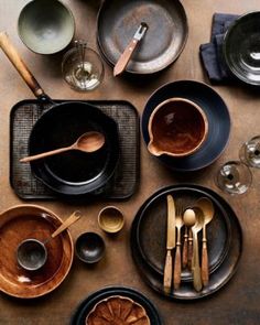 an assortment of dishes and utensils on a table