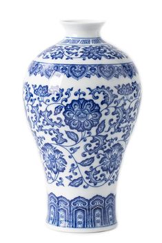 a blue and white vase sitting on top of a table