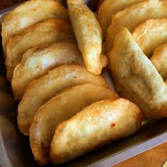 some fried food in a metal pan on a table