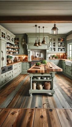 a large kitchen with wooden flooring and green cabinetry, along with an island in the center