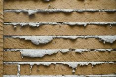 the wall is covered in ice and icicles