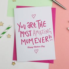 a greeting card with the words you are the most amazing mum ever written on it