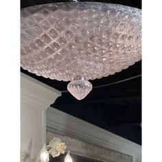 a chandelier hanging from the ceiling in a room