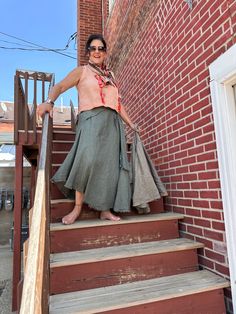 Stay breezy and chic with this Italian Linen Maxi Skirt! It has a wrap-around look with a buckle detail and a distressed hem for a boho-chic feel, all in one comfortable size. Whether you’re spending summer days in the sun or jet-setting to far-flung places, this skirt is perfect for the wanderlust life! Skirt With Buckle, Linen Maxi Skirt, White Charcoal, Linen Clothes, Jet Set, Summer Days, Boho Chic, Maxi Skirt, All In One