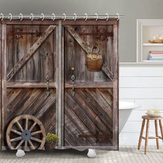 an old wooden door with wheels and baskets on the doors is shown in this bathroom