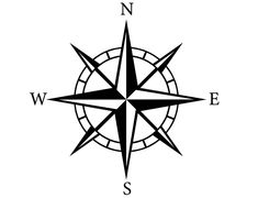 a black and white compass with the word w e s in it's center