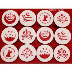 six white and red coasters with arabic designs on them, all in different shapes