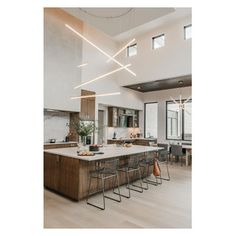 a large kitchen with an island in the middle and lots of counter space on each side