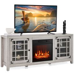 an entertainment center with a fireplace and television