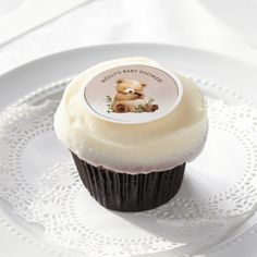 there is a cupcake with a teddy bear on it