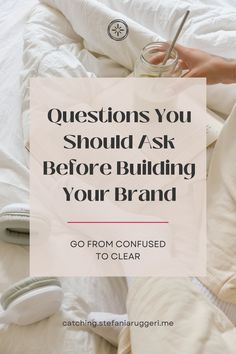 a person laying in bed with the words questions you should ask before building your brand