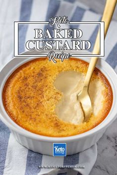 a bowl of baked custard with a spoon in it on a blue and white towel