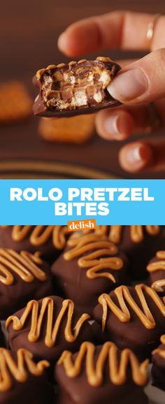 a hand holding a piece of chocolate covered pretzel bites