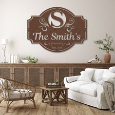 a living room filled with furniture and a sign on the wall that says, the smith's