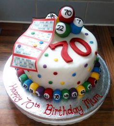 a birthday cake decorated with balls and numbers