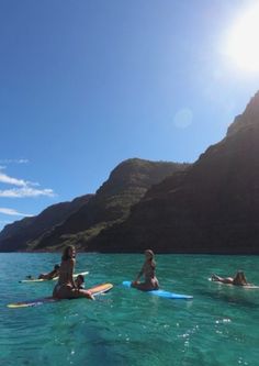 several people are in the water on surfboards