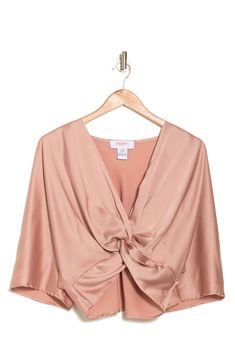 A plunging V-neck and long sleeves frame this solid colorway top that is crafted from satin fabric. 23" length (size S) Plunge neck Long sleeves 97% polyester, 3% spandex Hand wash, line dry Made in the USA of imported fabric Model stats: 5'10" height, 32" bust, 25" waist, 36" hip. Model is wearing size S. Satin V-neck Party Blouse, Satin V-neck Blouse For Night Out, Chic Satin V-neck Tops, Pink Satin Top For Evening, Spring Party Tops With Surplice Neckline, Infinity Top, Twist Top, Twist Knot, Wardrobe Ideas