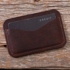 This minimalist Moose Leather Card Case has two side pockets for cards and a center compartment to keep your cash safe. It can comfortably hold up to 8 cards. Size is approximately 4″ x 2.75.” Crafted for years of use from sustainably-harvested Canadian moose leather. Due to the nature of moose leather, please expect variations in color. Designed, cut, and stitched in Maine. Leather Card Holder With Pockets For Everyday Use, Brown Card Holder With Pockets For Everyday, Rustic Brown Wallets With Card Slots, Canadian Moose, Cash Safe, Leather Card Case, Card Case, Moose, Leather Wallet