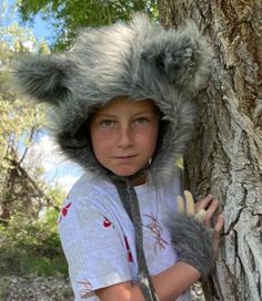 Wolf hat//faux fur wolf hat//grey wolf hat//fur wolf hat//wolf costume hat//wolf dress-up hat//fur hat//grey wolf//Halloween wolf hat Wolf hat of grey  faux fur is ultra soft and fluffy.  Inner lining and ties are a soft grey flannel.  Wolf ears poke up adorably.  Wolf hat is perfect for Halloween or play time. Wolf claws are now available in variations.  Claws are made of matching fur and gray fleece that wrap around wrist and attach firmly with velcro. **please note: wolf only comes in the gre Wolf Cut Hat, Diy Wolf Headdress, Winter Costume Cat Ears Hats And Headpieces, Wolf Headband, Wolf Headpiece, Wolf Claws, Halloween Wolf, Wolf Dress, Wolf Hat