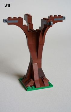 a lego model of a tree on a white surface