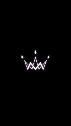 the crown is glowing in the dark with white lights on it's sides and black background