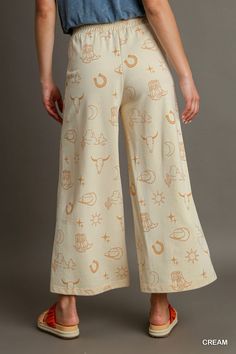 our french terry wide leg elastic waistband pants with graphic print & side pockets! who says style and comfort can't coexist? get ready to kick back and relax in these wide leg pants, complete with an elastic waistband (for indulging in all the snacks). plus, with a graphic print and handy side pockets, you'll be looking and feeling like a fashionista.shop our matching set, french terry graphic printed top!fabric contents & fit notes:• model is 5'9" and is wearing a small.• all measurements are Waistband Pants, Elastic Waistband Pants, Polyester Pants, Midi Maxi Dress, Top Fabric, Printed Pants, British Indian, Casual Fits, Ethiopia